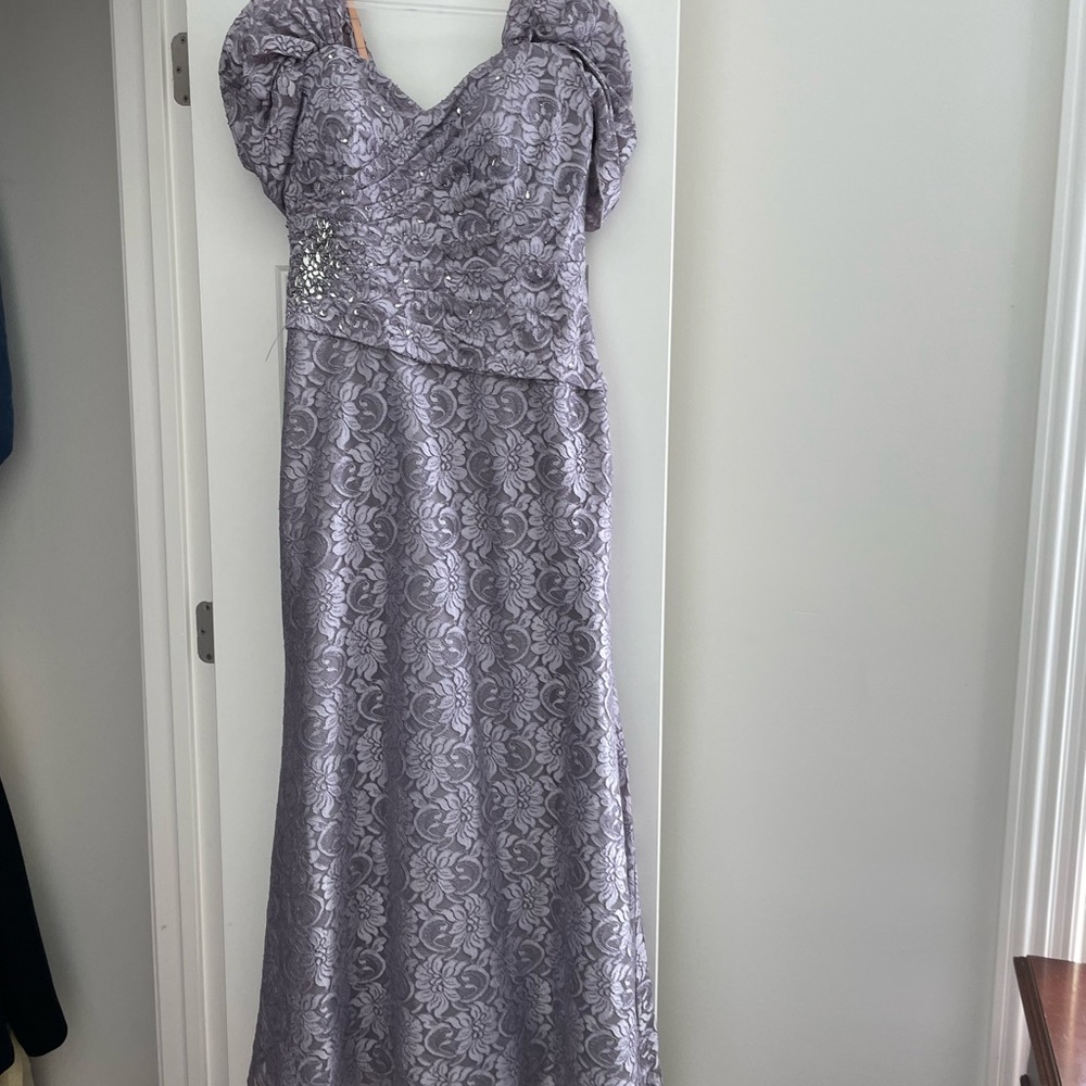 Beautiful mother of the bride gowned in a soft purple